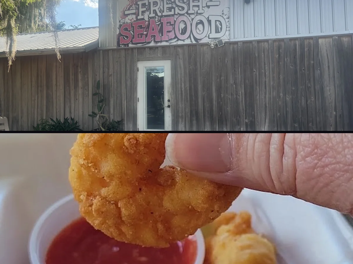 Covered outdoor seating beside a seafood meal.